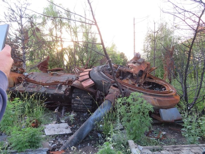 A destroyed T-72 in Ukraine, being reclaimed by nature.